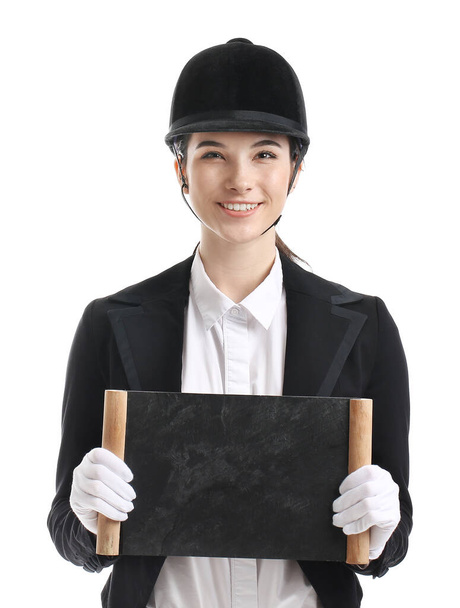 Female jockey with blank chalkboard on white background - Foto, immagini