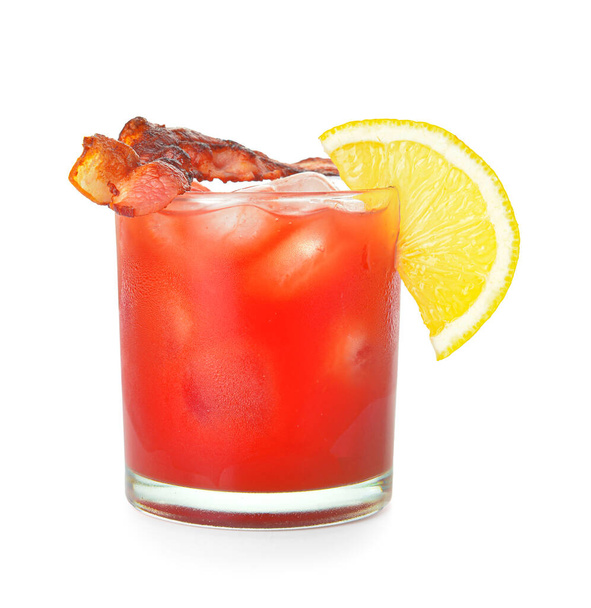 Glass of bloody mary cocktail garnished with bacon on white background - Photo, Image