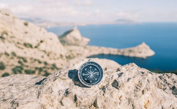 Compass on a mountain top without people. - Zdjęcie, obraz