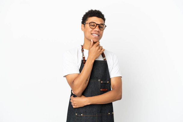 Restaurant African American waiter man isolated on white background with glasses and smiling - Фото, изображение
