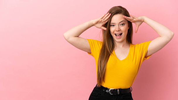 Teenager girl over isolated pink background with surprise expression - Photo, Image