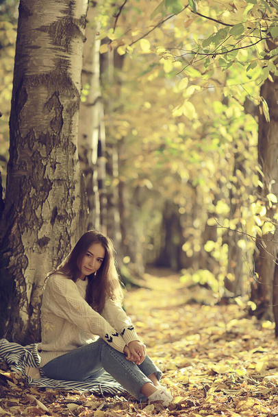 sad girl in autumn park, stress loneliness young person female - Fotografie, Obrázek