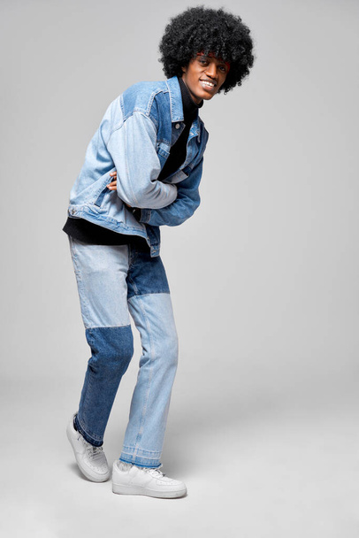 Happy african american man in stylish denim clothes - Фото, изображение
