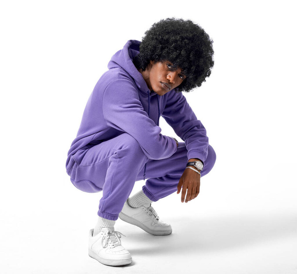 Young african man wear track suit isolated on white background - Foto, afbeelding