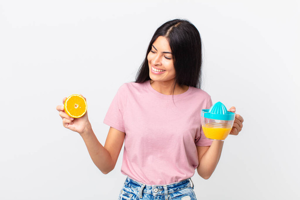 hispanic pretty woman. orange juice and breakfast concept - Zdjęcie, obraz