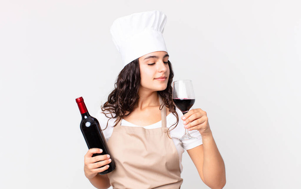 hispanic pretty chef woman with a bottle of wine - Fotografie, Obrázek