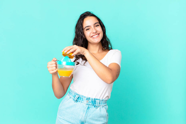 hispanic pretty chef woman. orange juice concept - Valokuva, kuva