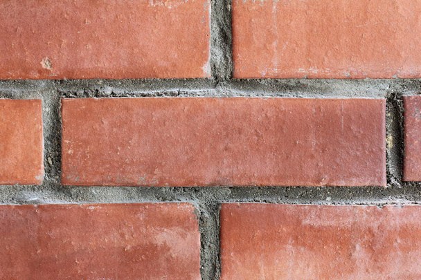 shabby red brick in masonry close-up. fragment of an old house wall - Foto, immagini