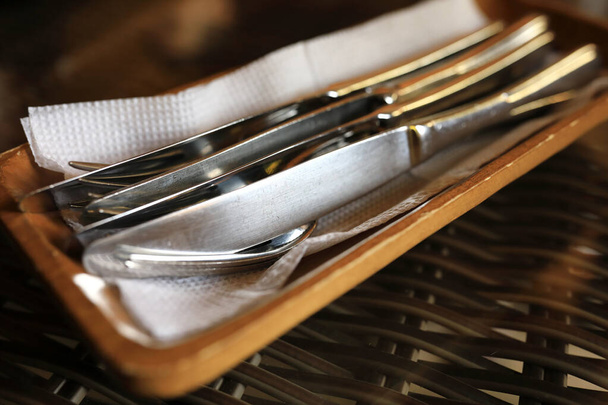 Forks and knives on plate in restaurant - Фото, изображение