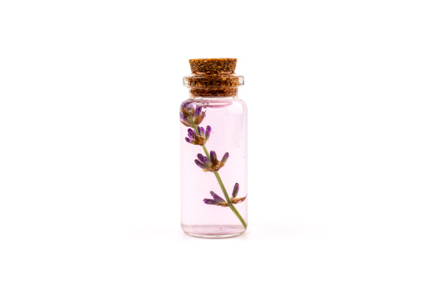 lavender essential oil in a beautiful bottle on the White background - Photo, Image