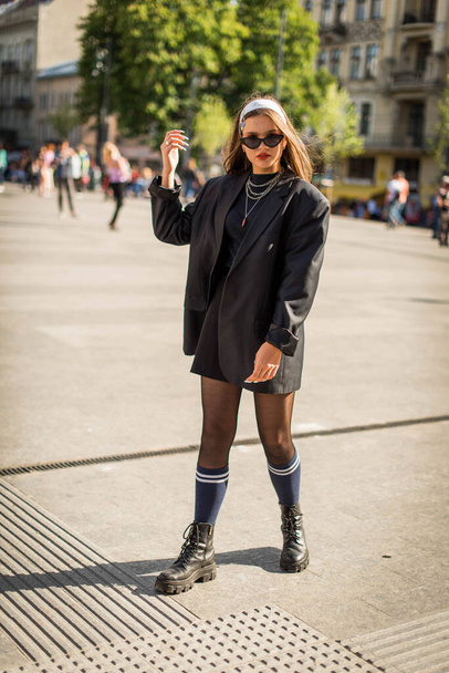 Beautiful country girl in 90s style. Back in time 90s 80s. Stylish girl in retro colourful vintage coat. dressed in street style clothes with chains around neck for a walk. Youth and lifestyle concept - Foto, Bild