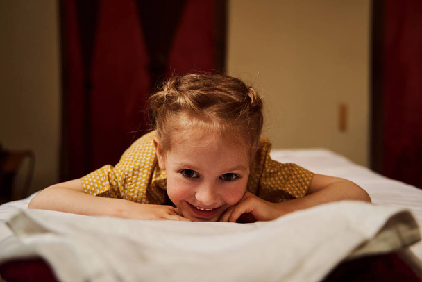 Female kid looking at camera with smile - Valokuva, kuva