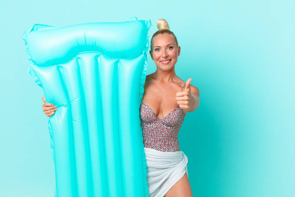 young pretty woman with a inflatable mattress. summer concept - Foto, Imagen