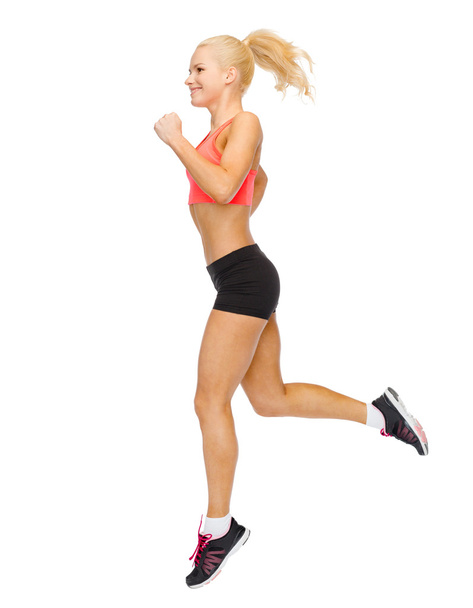 sporty woman running or jumping - Fotografie, Obrázek