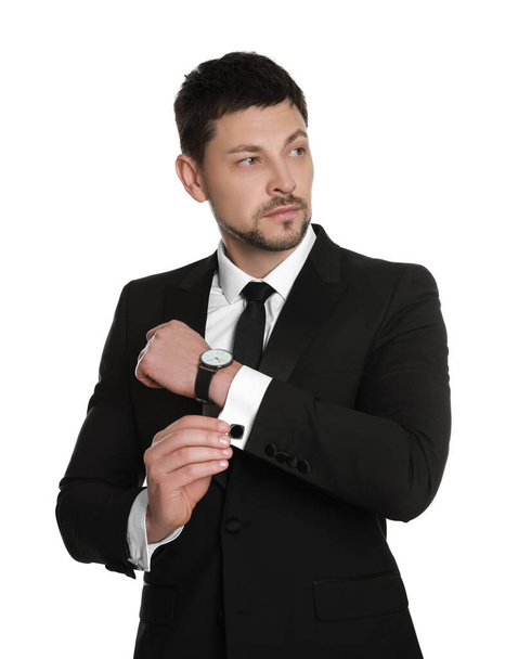 Man wearing stylish suit and cufflinks on white background - Фото, зображення