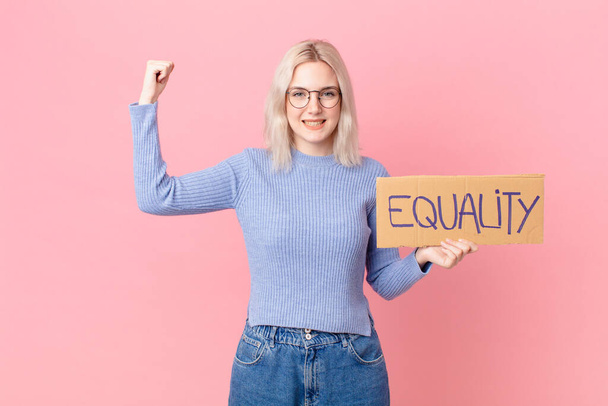 blond woman with a equality concept banner - Zdjęcie, obraz