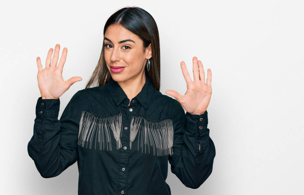 Young hispanic woman wearing casual clothes showing and pointing up with fingers number six while smiling confident and happy.  - Fotoğraf, Görsel