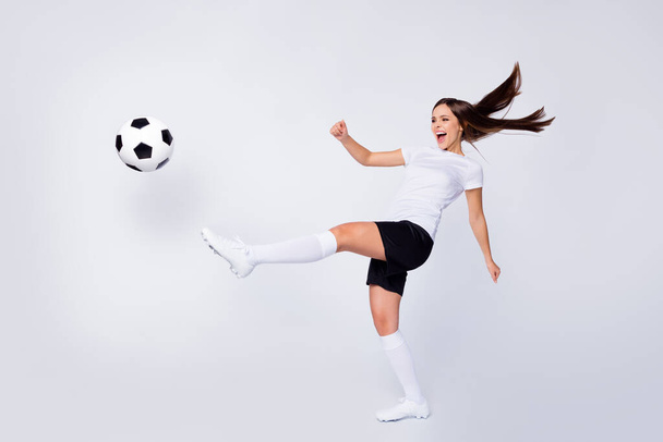 Full body photo of excited captain lady player soccer women team kick leg ball yelling teammate wear football uniform t-shirt shorts boots knee socks isolated white color background - Φωτογραφία, εικόνα