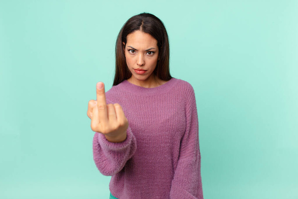 young hispanic woman feeling angry, annoyed, rebellious and aggressive - Фото, зображення