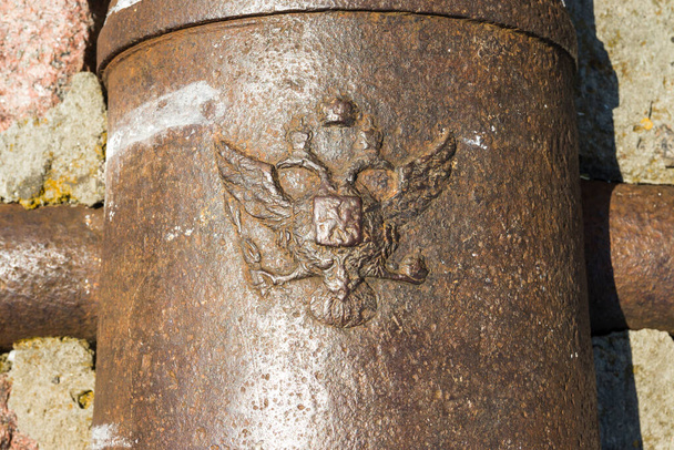 Coat of arms of the Russian Empire on old cannons in Kyiv fortress, a complex of Russian fortifications in Ukrainian capital built over the span of 17-19th centuries. - Photo, Image