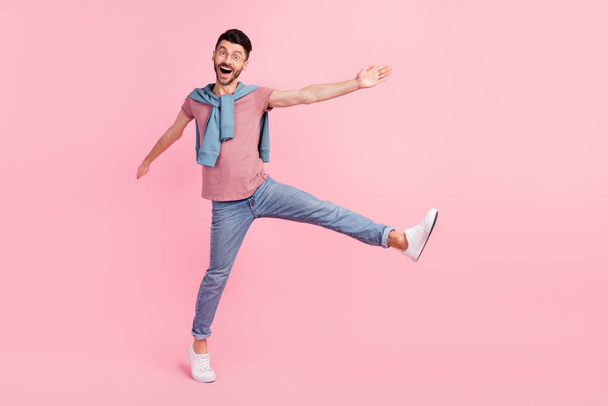 Full size photo of funky crazy happy man raise leg hand weekend wear glasses isolated on pink color background - Foto, Imagem