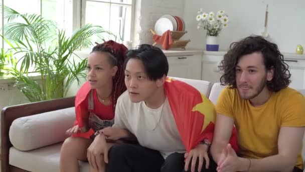 Chinese fans watch sports at home on TV. Emotional fans friends with the flag of China - Footage, Video