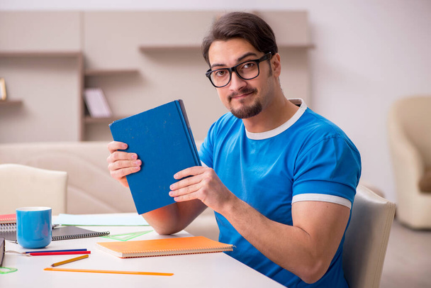 Young male student studying at home - Photo, Image