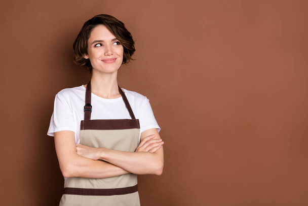 Photo of happy dreamy charming beautiful girl with folded arms coffee shop owner look copyspace isolated on brown color background - Fotoğraf, Görsel