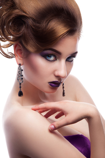 Stunning female looking at camera with make up and creative hair - Foto, afbeelding