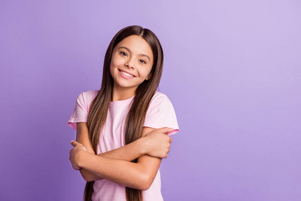 Photo of young cheerful girl happy positive smile hug herself comfort cozy isolated over violet color background - Fotoğraf, Görsel