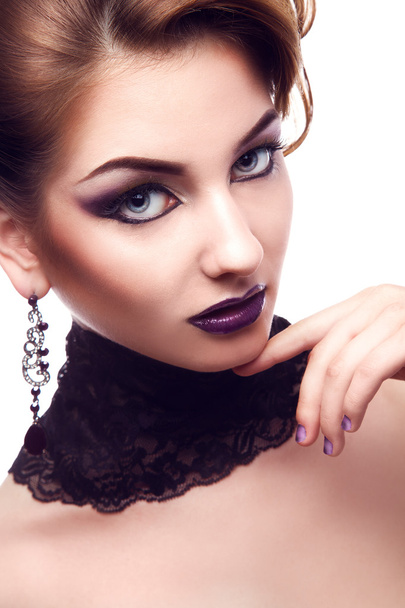 Vertical portrait of serious woman with violet make up - Foto, Bild