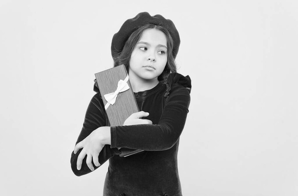 sad child hold present box on her birthday holiday celebration, boxing day - Fotó, kép