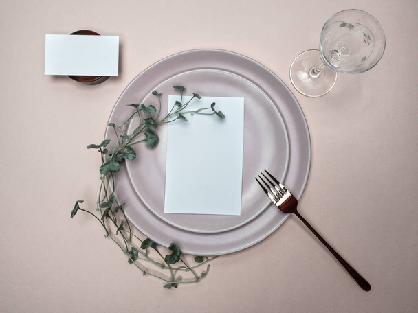 Table place and menu mockup. Wedding and Birthday table setting with foliage. - Фото, зображення