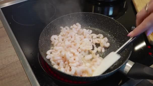 Process of roasting peeled shrimps in a frying pan, close-up. Prawns fried. home made Seafood - Footage, Video