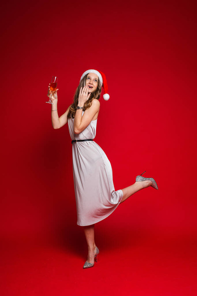 beautiful female fashion model in white dress drinks champagne - Foto, imagen