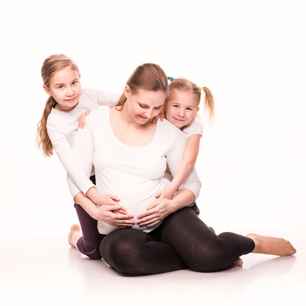 Happy pregnant woman with her kids - 写真・画像