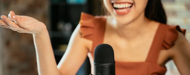Woman with mic recording a podcast - Фото, зображення