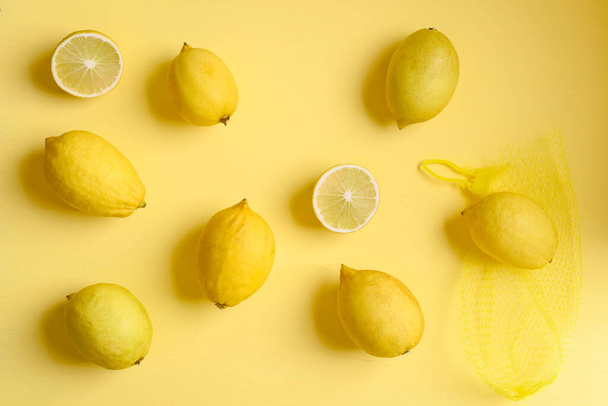 Fresh lemon on yellow color background, Flat lay, Top view - Photo, Image
