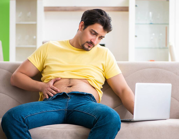 Man searching information in Internet in dieting concept - Photo, Image