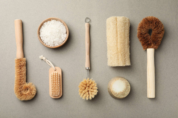 Flat lay composition with eco friendly products on light grey background. Conscious consumption - 写真・画像