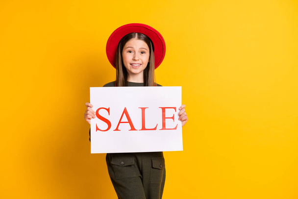 Photo portrait of lovely girl keeping sale carton on black friday isolated vibrant yellow color background - Foto, Imagem
