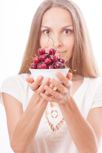 bowl of cherries in womens hands - Fotoğraf, Görsel