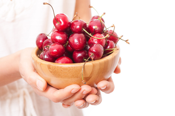 bowl of cherries in womens hands - Photo, image