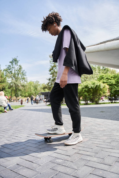 Skateboarder wearing casual clothes preparing to the riding at the skateboard - Φωτογραφία, εικόνα