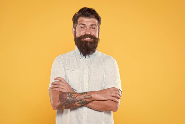charismatic guy looking happy. male barber fashion. hair and beard care. bearded cook in white shirt. brutal caucasian hipster with moustache. confident and handsome brutal man. Facial care - Foto, imagen