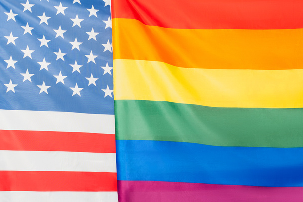 close up of american and lgbt flags, equality rights concept - Photo, Image