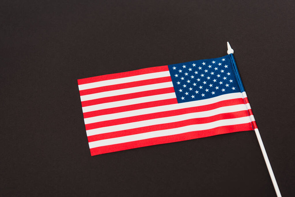 red and blue flag of america isolated on black  - Φωτογραφία, εικόνα