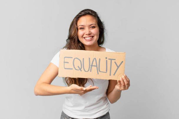 young pretty woman holding a equality banner - Foto, Bild