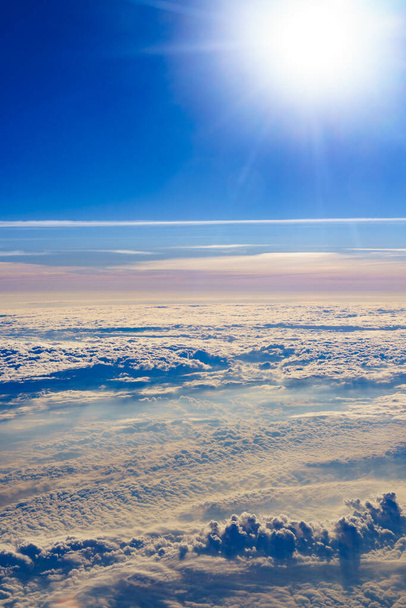 View from airplane window to clouds - 写真・画像