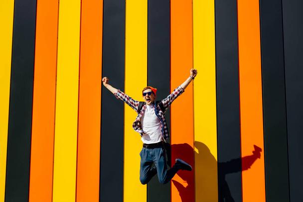 I won, Achieving success happy young man celebrating victory, on isolated color bright wall background, Victory, delight concept. Human emotion concept - Fotó, kép